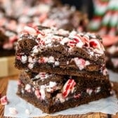 stacked brownies with peppermint crushed on top.