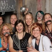 women in photo smiling for camera