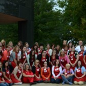 crowd of people with red aprons